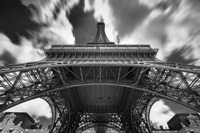 Low angle view of replica eiffel tower against dramatic sky
