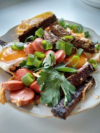 High angle view of breakfast in plate on table at home