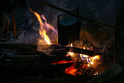 High angle view of fire on barbecue grill