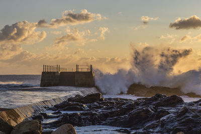 Scenic view of sea against sky during sunset