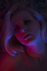 Portrait of a beautiful young woman, neon lights