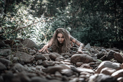 Portrait of woman in forest