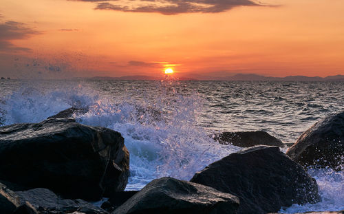 Scenic view of sea against sky at sunset