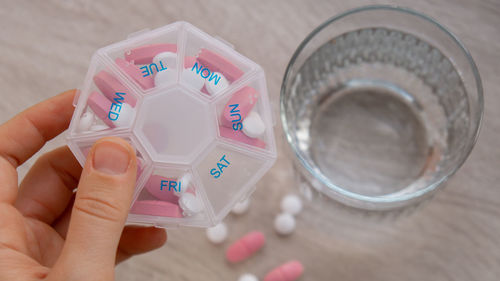 Close-up of hand holding pills