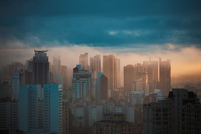 Modern buildings in city against sky