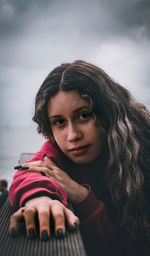 Portrait of beautiful woman against sky