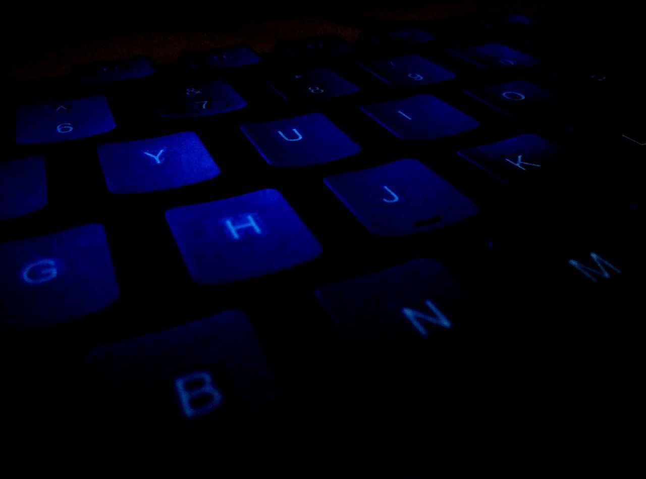 indoors, illuminated, communication, close-up, text, technology, night, blue, backgrounds, western script, number, full frame, capital letter, dark, no people, connection, pattern, computer keyboard, light - natural phenomenon, high angle view
