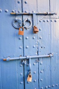 Close-up of closed door with padlock