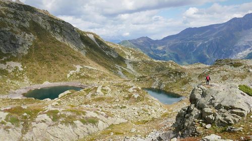 Scenic view of mountains against cloudy sky