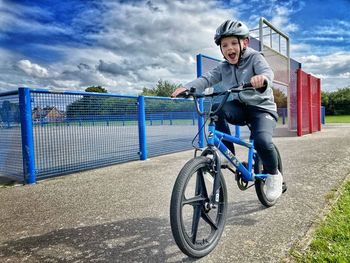 Rear view of man riding bicycle