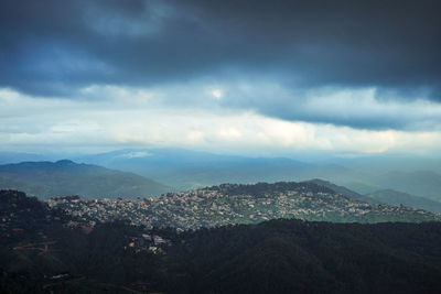 Aerial view of townscape against sky