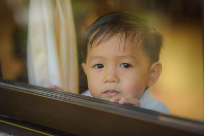 Portrait of cute boy looking away