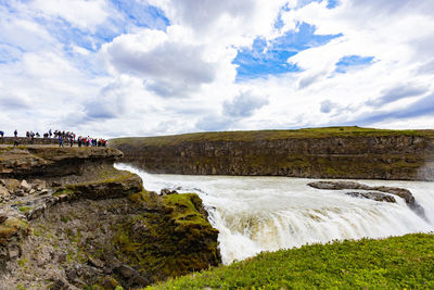 Scenic view of sea against cloudy sky