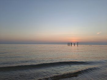 Scenic view of sea against clear sky during sunset