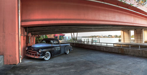 Car on bridge in city