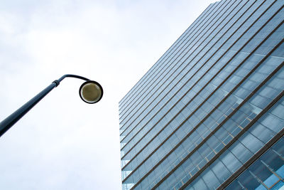 Low angle view of street light against sky