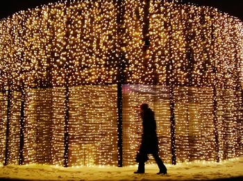 Woman standing in the dark