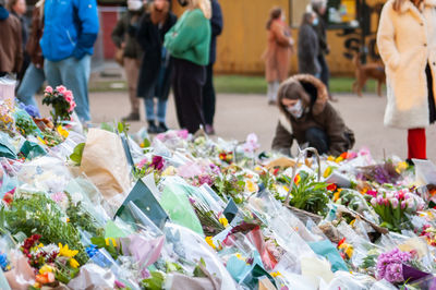 Group of people at market stall