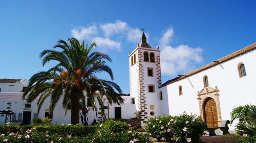 Low angle view of building against blue sky