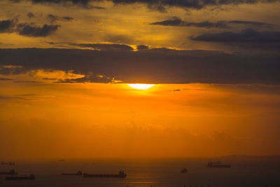 Scenic view of sea against orange sky