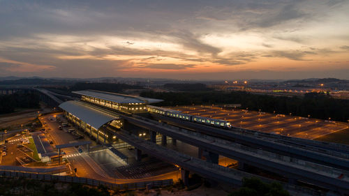 High angle view of city at sunset