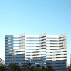 Buildings in city against clear sky