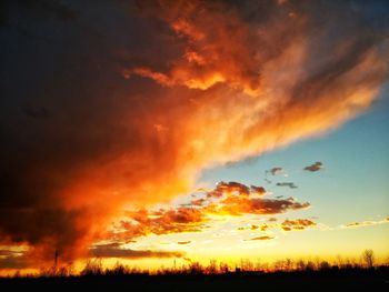 Scenic view of dramatic sky during sunset