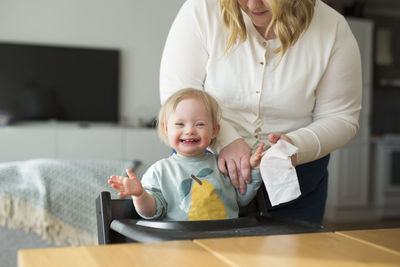 Portrait of cute girl playing with toy blocks on table