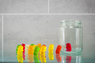 Close-up of candies in glass jar on table