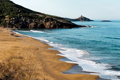 Scenic view of beach against sky