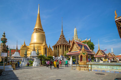 Group of people in temple outside building