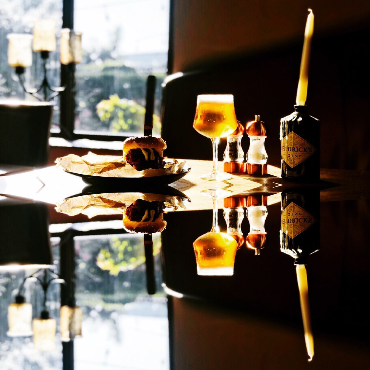 CLOSE-UP OF BEER BOTTLES ON TABLE