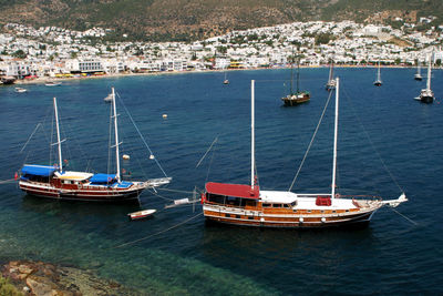 High angle view of sailboats moored in sea