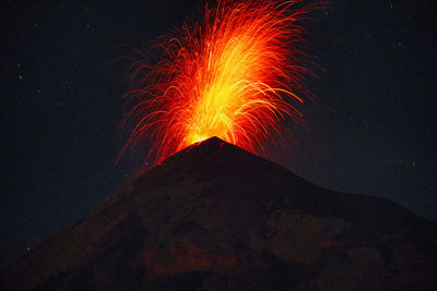 Scenic view of mountain against sky at night