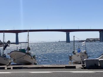 View of bridge over sea against clear sky