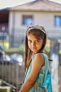 Side view portrait of innocent girl wearing tiara