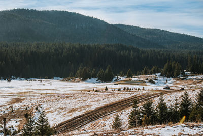 Scenic view of snow covered landscape against sky