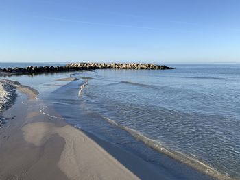 Scenic view of sea against clear blue sky