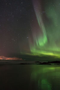 Scenic view of landscape against sky at night