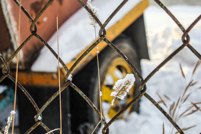 Close-up of chainlink fence against sky