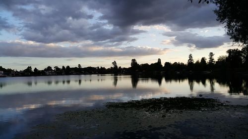 Scenic view of lake against sky during sunset