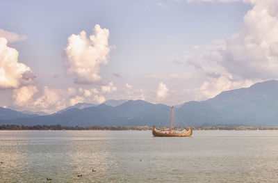 Sailboat on sea against sky