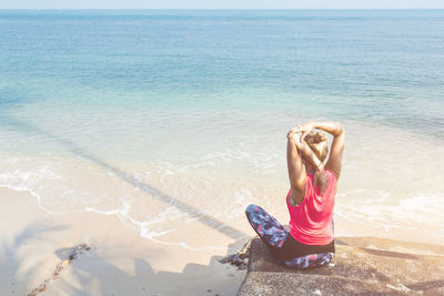 Full length of woman on beach against sky