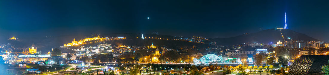 Illuminated buildings in city at night