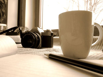 Close-up of coffee cup on table