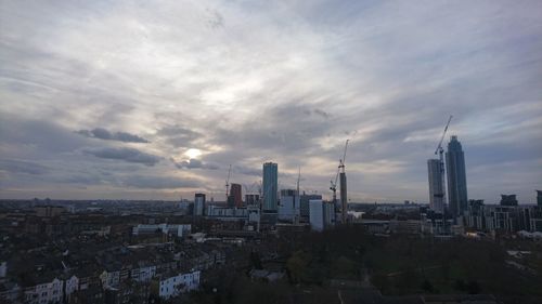 Cityscape against sky during sunset