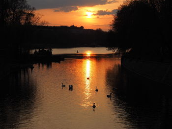 Scenic view of lake at sunset