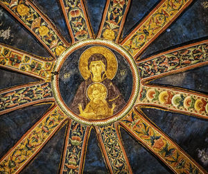 Low angle view of ornate ceiling in temple