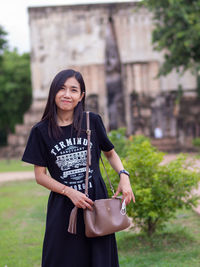 Portrait of young woman using mobile phone