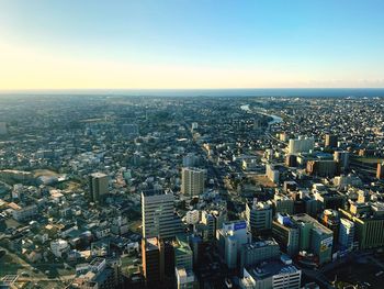 High angle view of modern buildings against clear sky